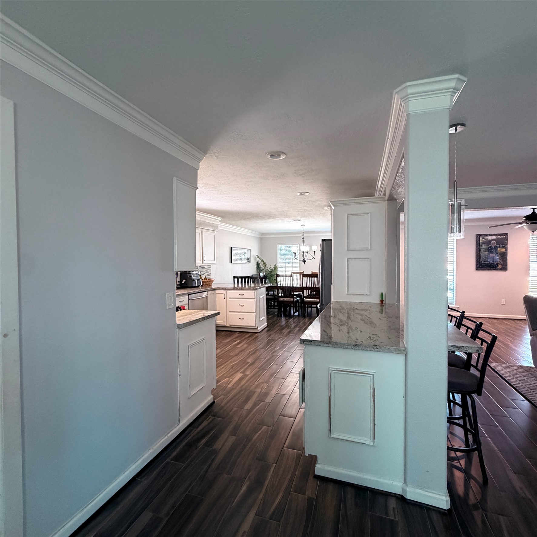 544 Brandon Road Conroe, TX 77302 - Photo 11 of 16 a kitchen with granite countertop white cabinets and white appliances