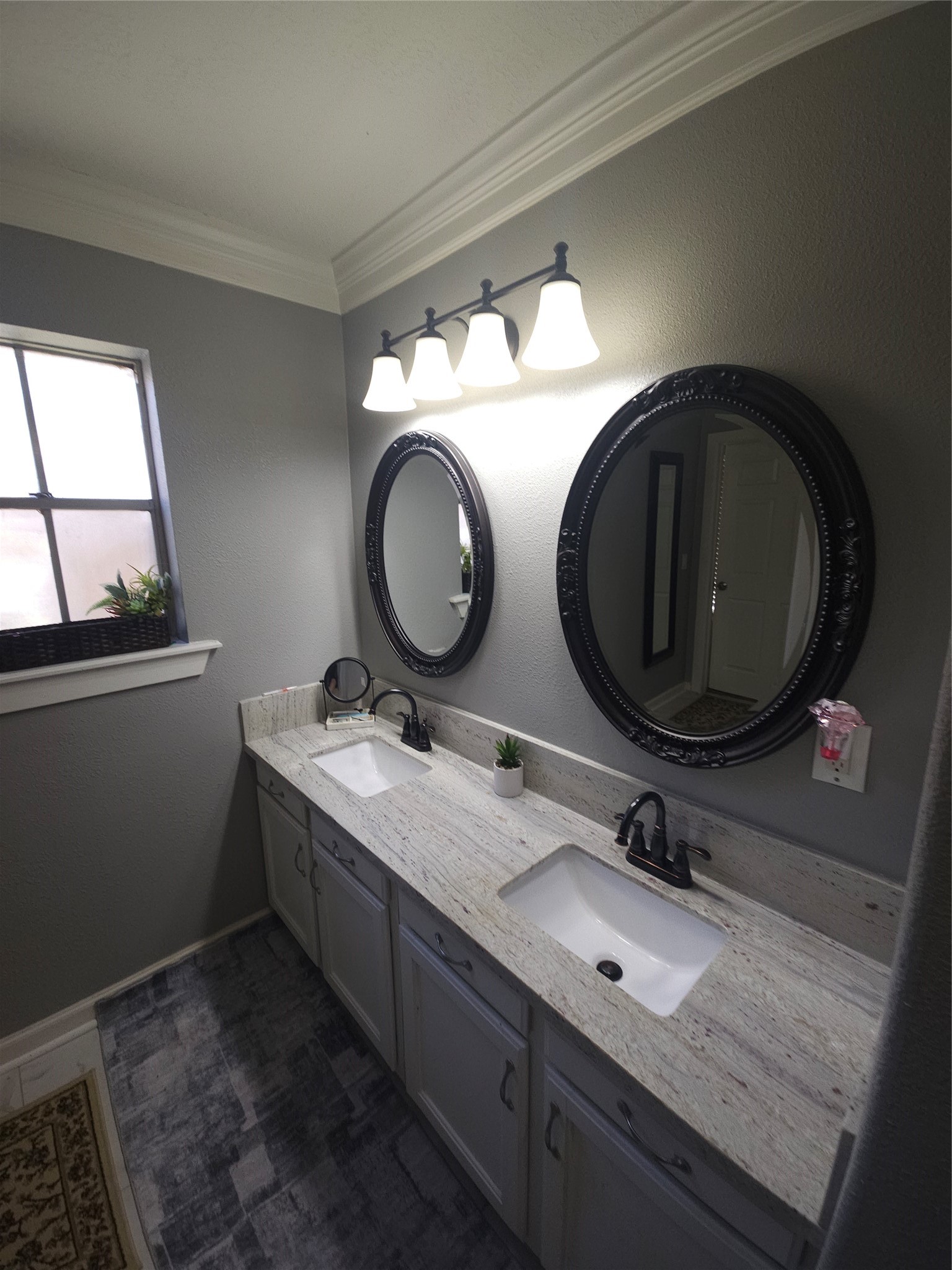 544 Brandon Road Conroe, TX 77302 - Photo 16 of 16 a bathroom with a granite countertop double vanity sink and a mirror