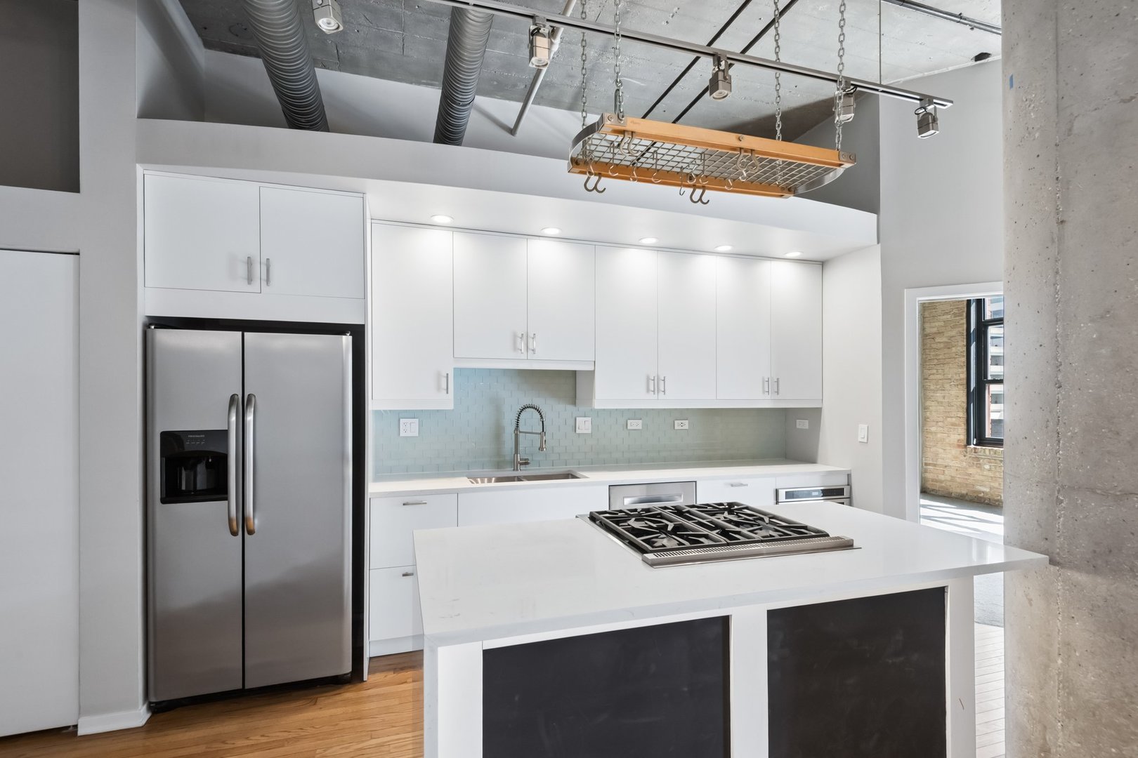 360 West Illinois Street, Unit 5F Chicago, IL 60654 - Photo 11 of 36 a kitchen with a sink a refrigerator and a stove