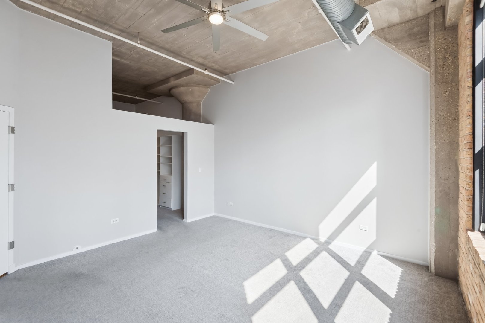 360 West Illinois Street, Unit 5F Chicago, IL 60654 - Photo 20 of 36 a view of an empty room with windows