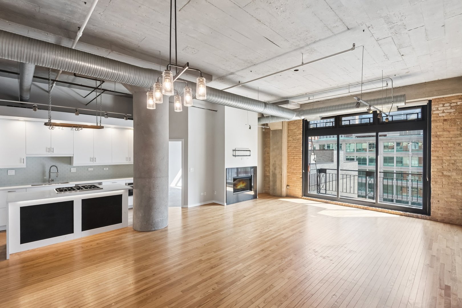 360 West Illinois Street, Unit 5F Chicago, IL 60654 - Photo 2 of 36 a view of a kitchen with a sink and a large window