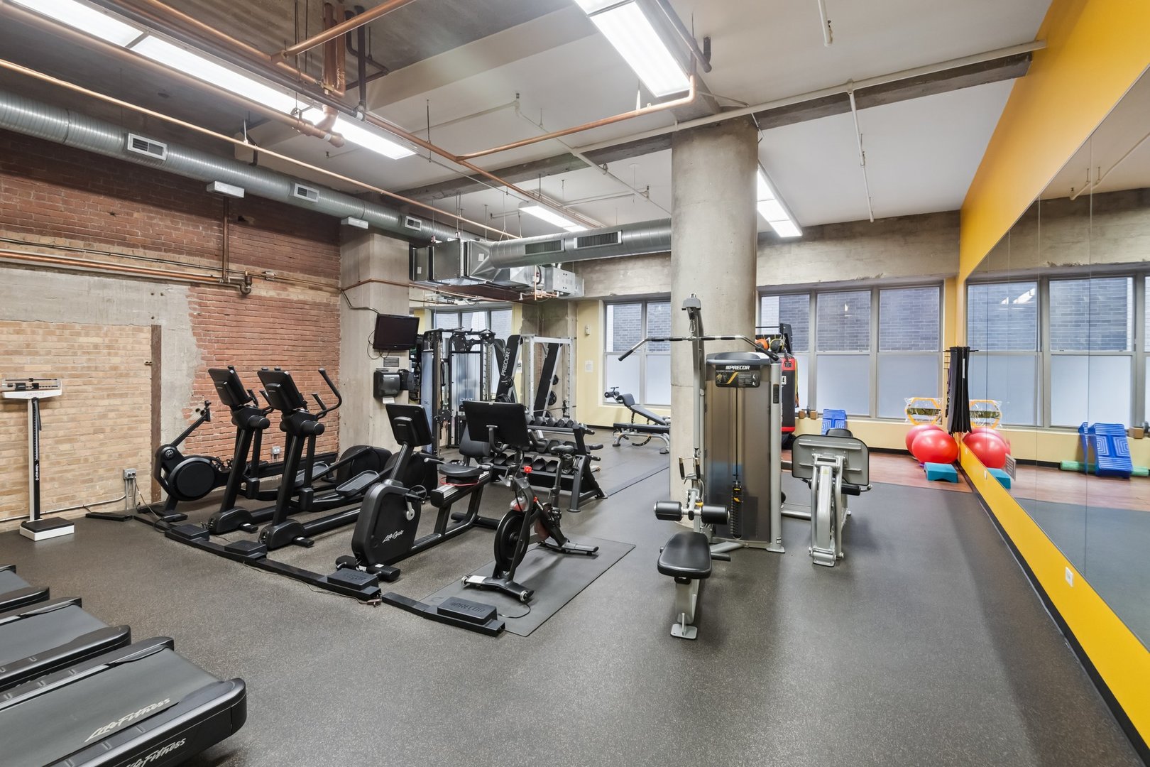 360 West Illinois Street, Unit 5F Chicago, IL 60654 - Photo 34 of 36 a view of a room with gym equipment