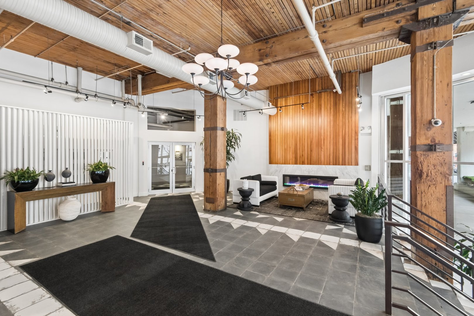 360 West Illinois Street, Unit 5F Chicago, IL 60654 - Photo 35 of 36 a lobby with furniture and chandelier