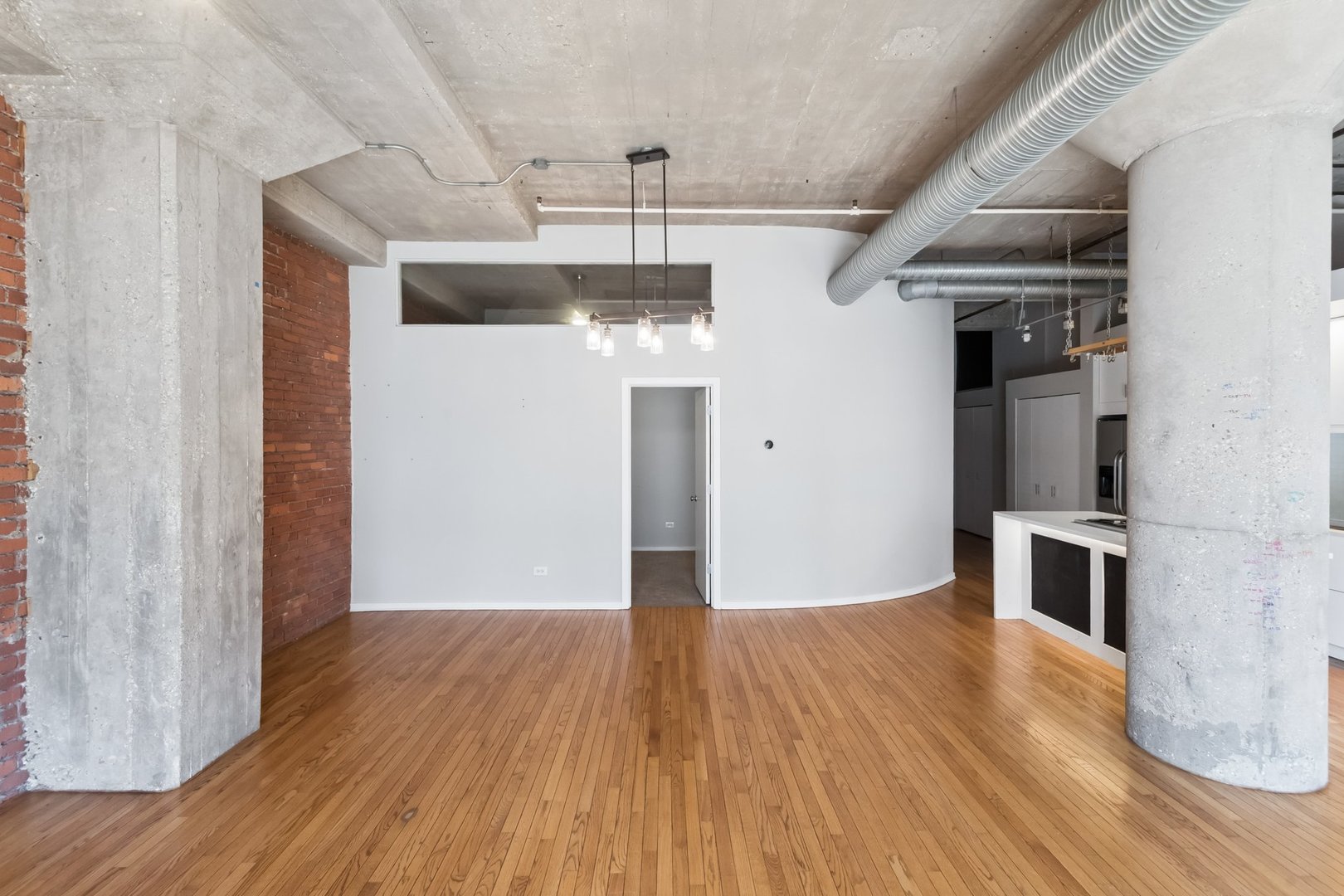 360 West Illinois Street, Unit 5F Chicago, IL 60654 - Photo 10 of 36 a view of empty room with wooden floor