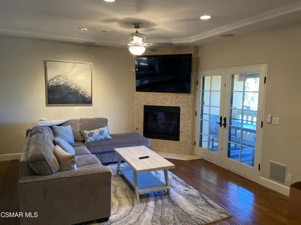 a living room with furniture and a fireplace