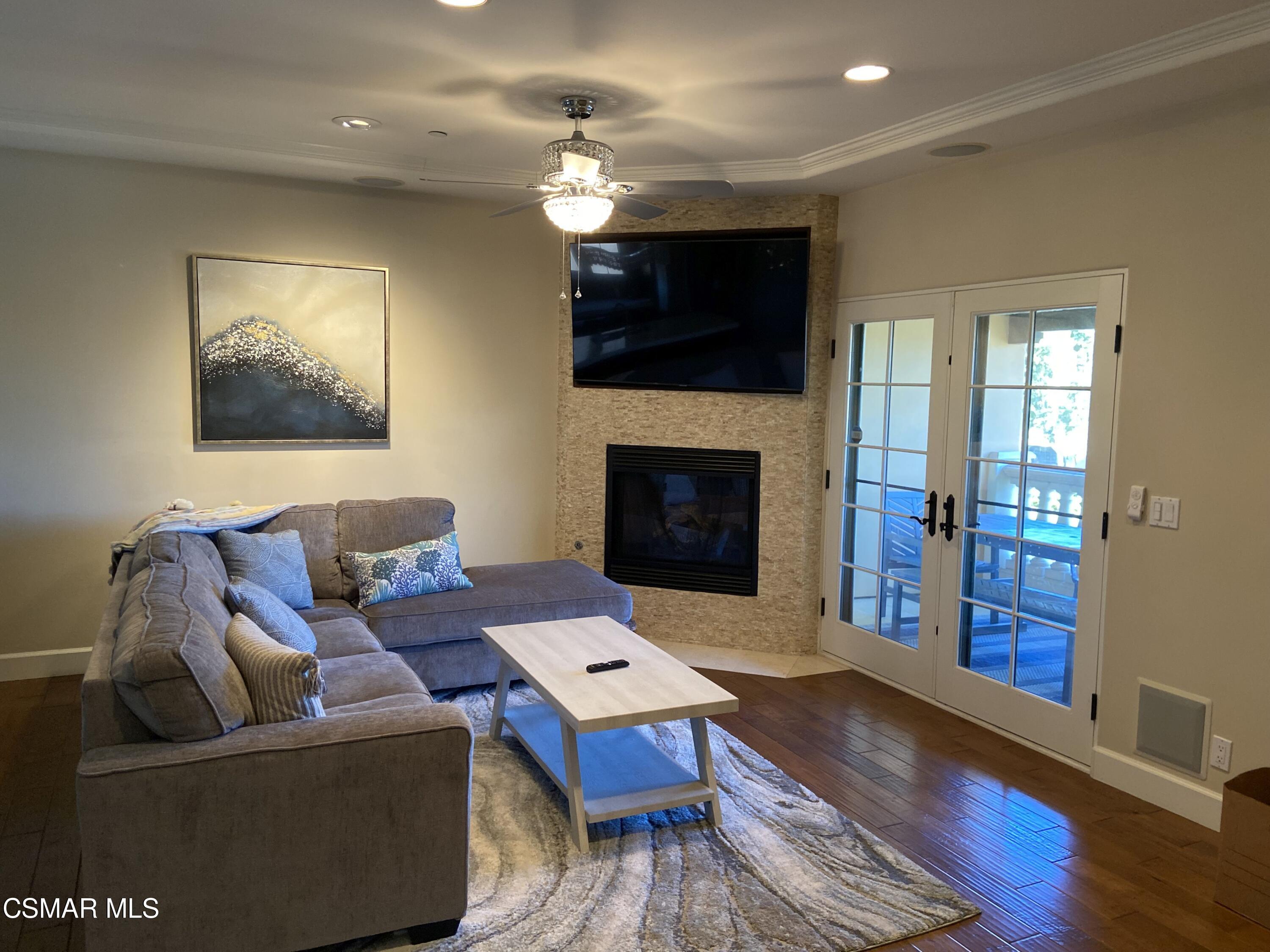 5109 West Wooley Road Oxnard, CA 93035 - Photo 5 of 12 a living room with furniture and a fireplace