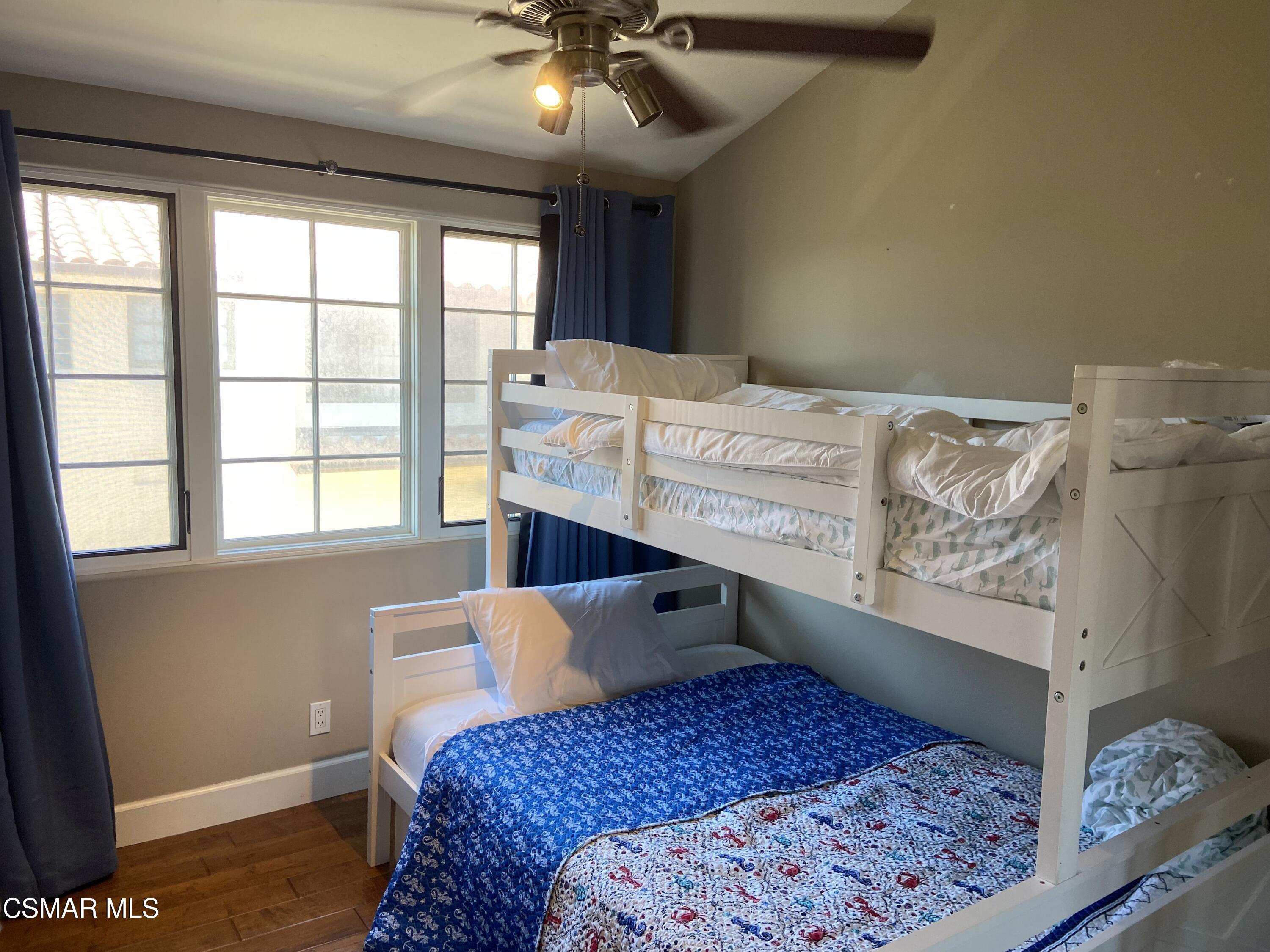 5109 West Wooley Road Oxnard, CA 93035 - Photo 8 of 12 a bedroom with a bed and window