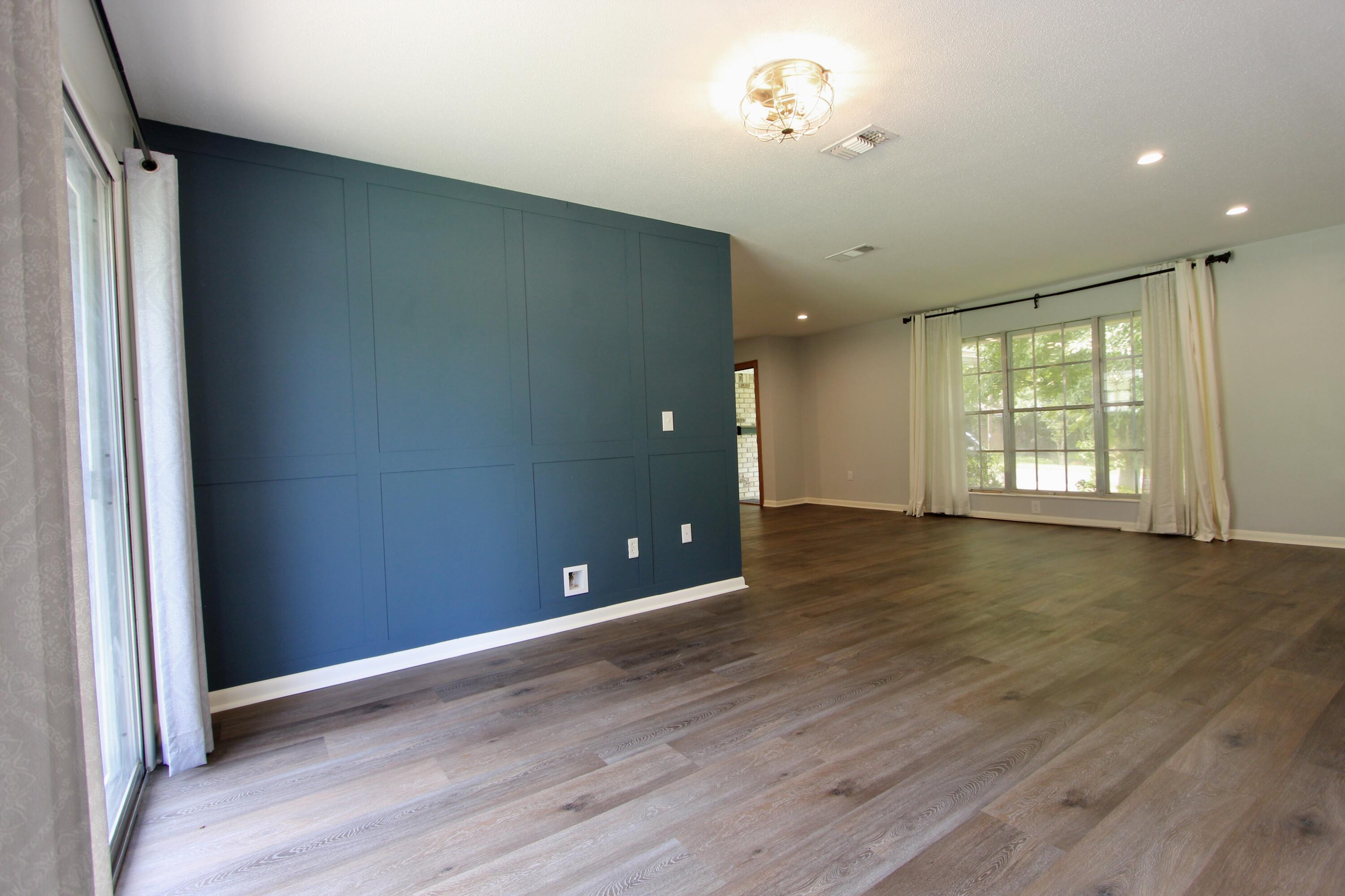35 Birch Avenue Shalimar, FL 32579 - Photo 11 of 35 an empty room with wooden floor and windows