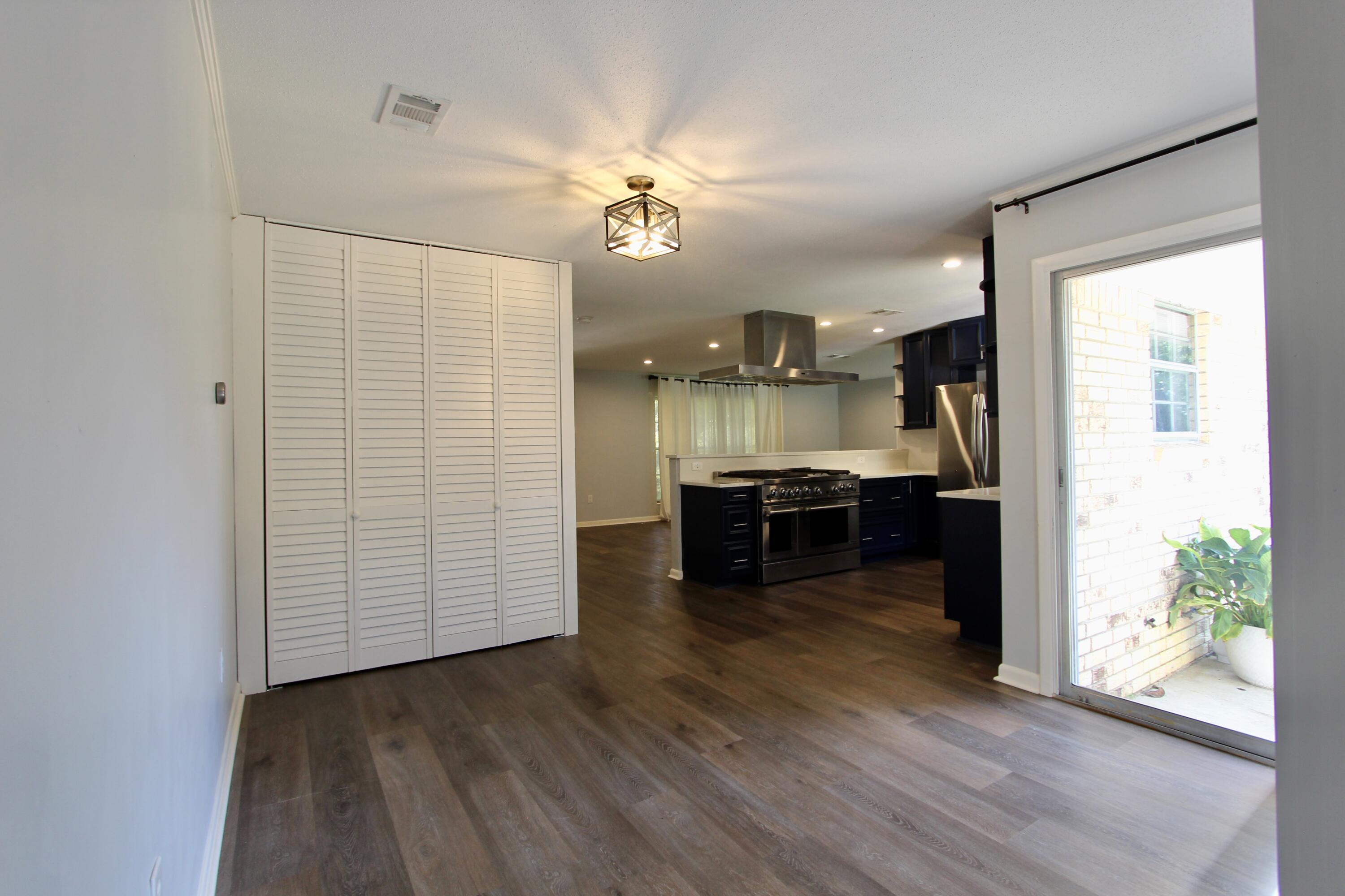 35 Birch Avenue Shalimar, FL 32579 - Photo 12 of 35 a view of kitchen with furniture and wooden floor