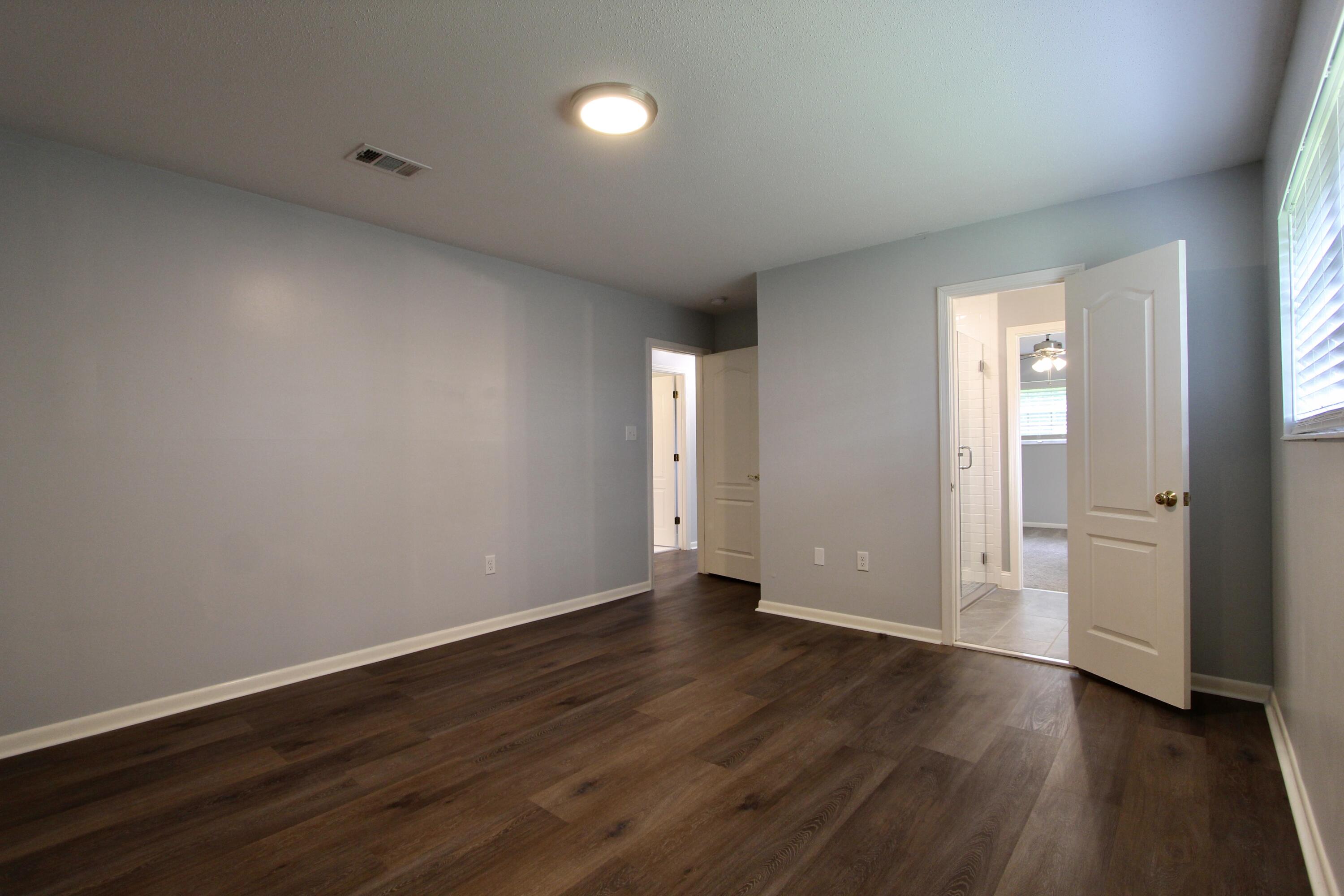 35 Birch Avenue Shalimar, FL 32579 - Photo 15 of 35 an empty room with wooden floor and windows