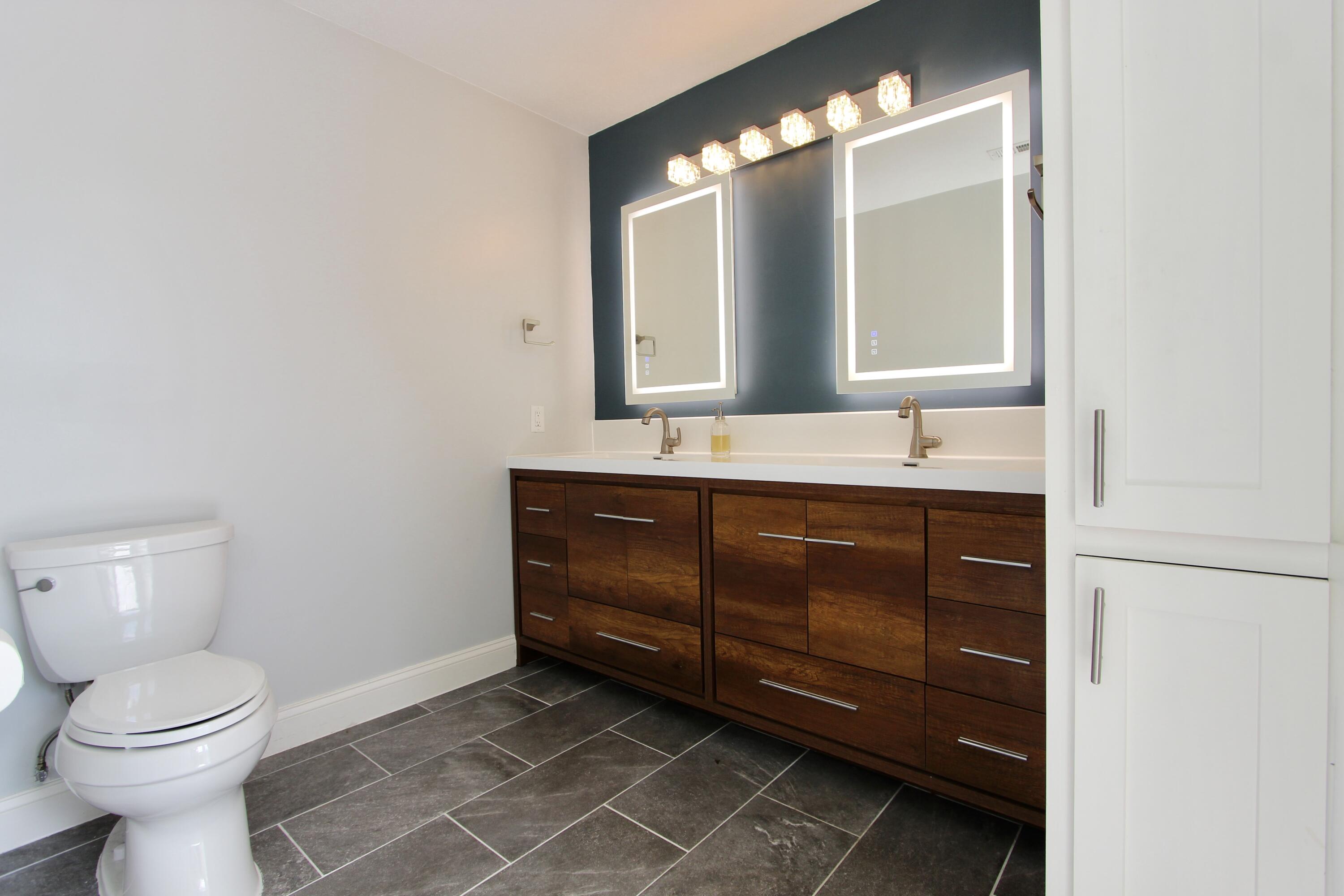 35 Birch Avenue Shalimar, FL 32579 - Photo 26 of 35 a bathroom with a toilet sink and mirror