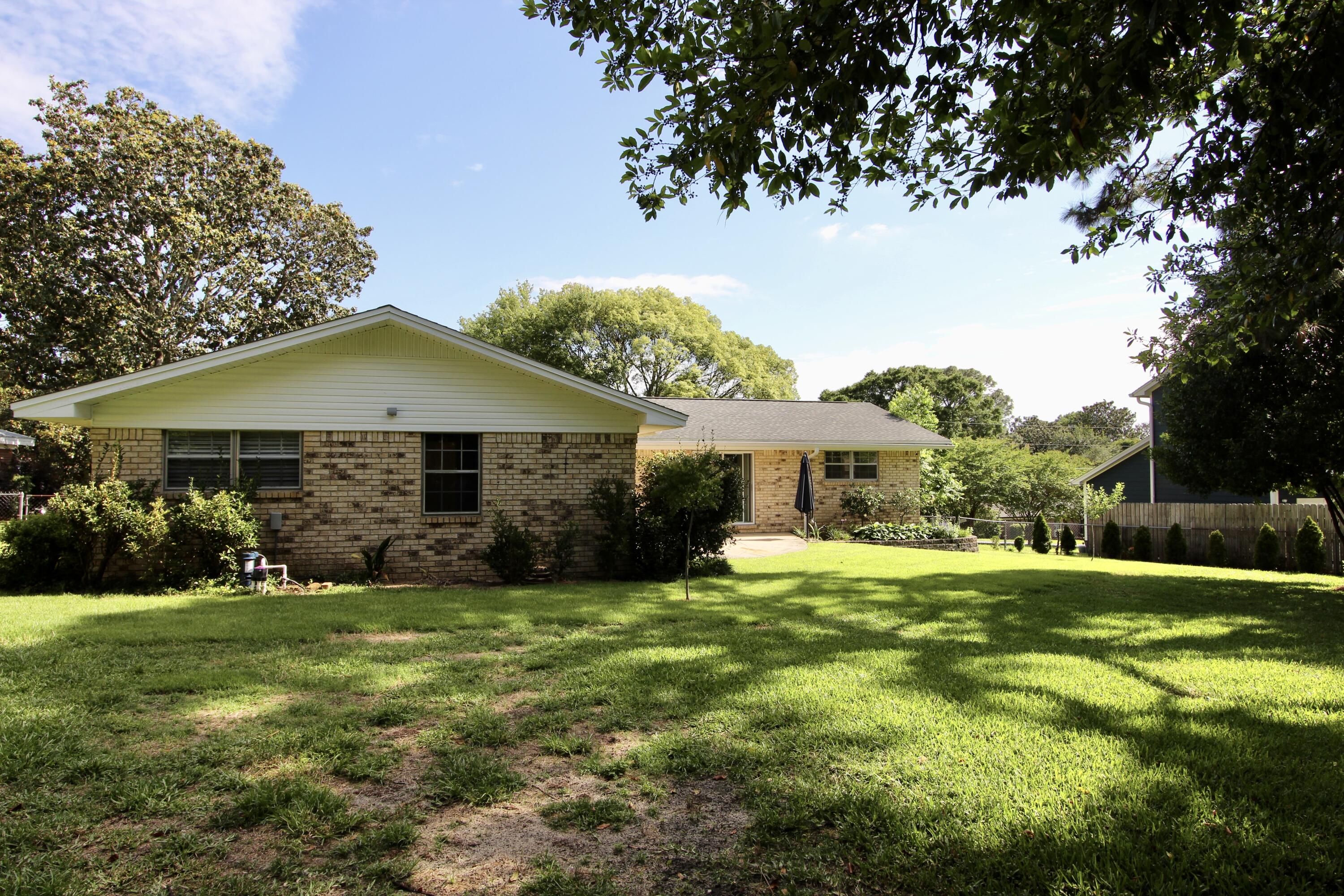 35 Birch Avenue Shalimar, FL 32579 - Photo 31 of 35 a front view of a house with a yard and garage