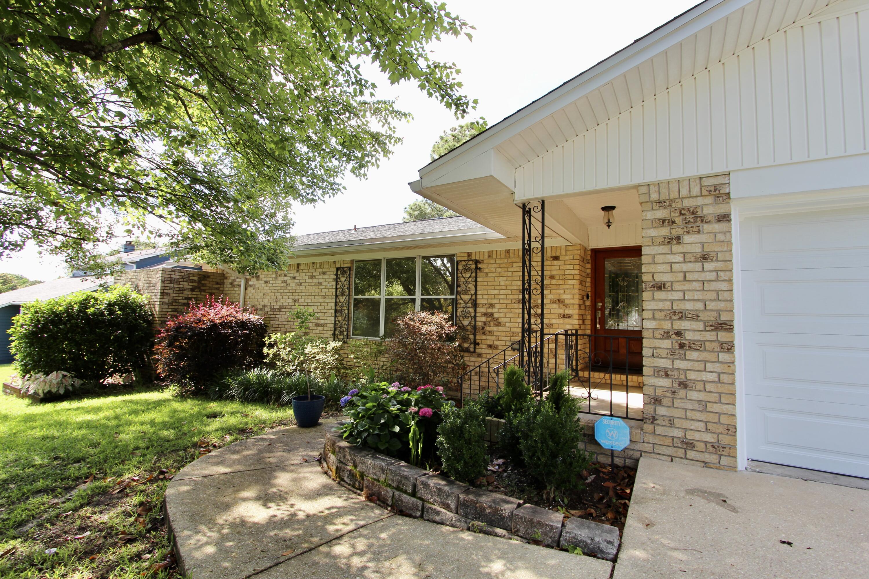 35 Birch Avenue Shalimar, FL 32579 - Photo 4 of 35 a front view of a house with garden