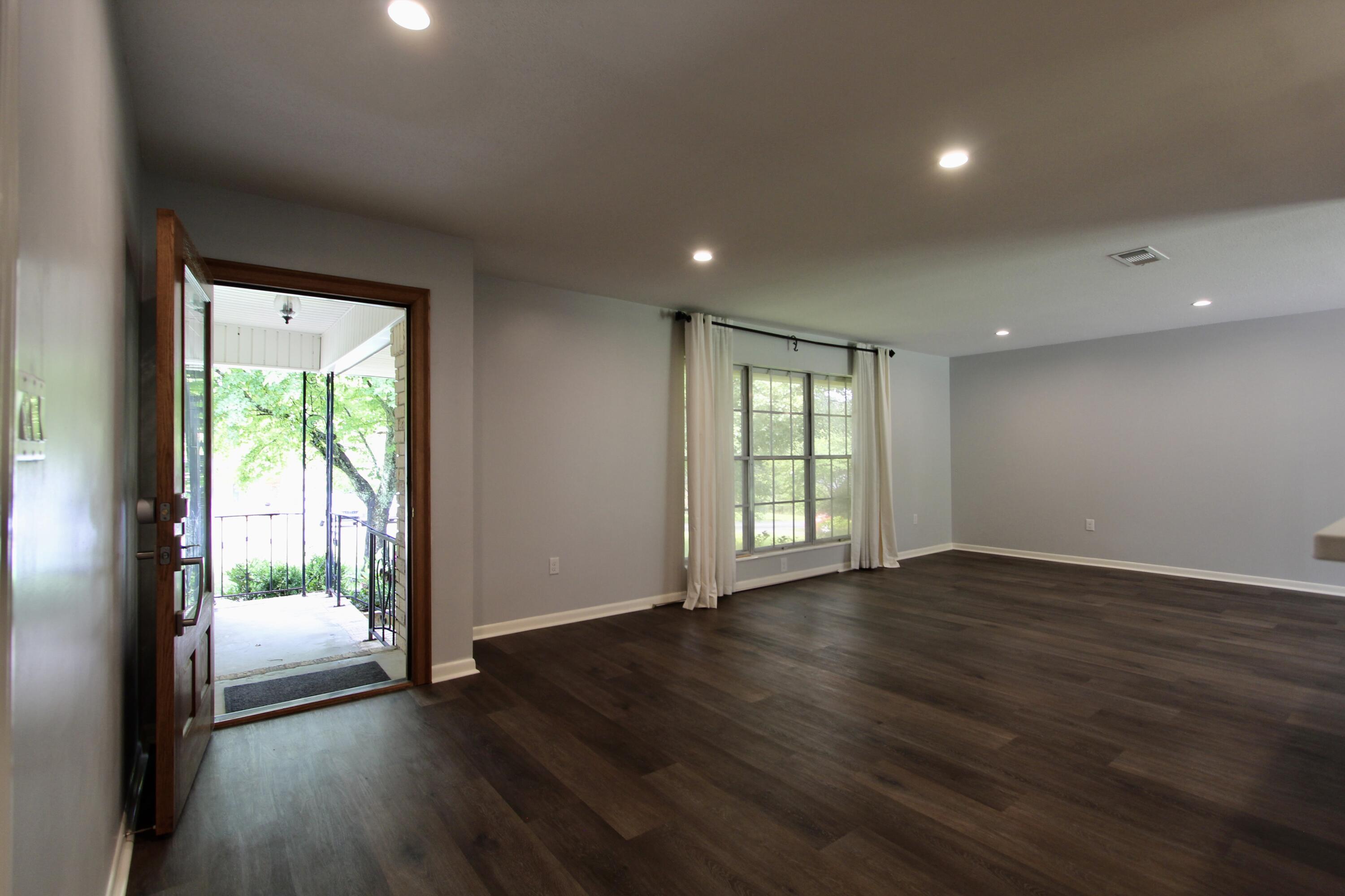 35 Birch Avenue Shalimar, FL 32579 - Photo 9 of 35 a view of an empty room with wooden floor and a window