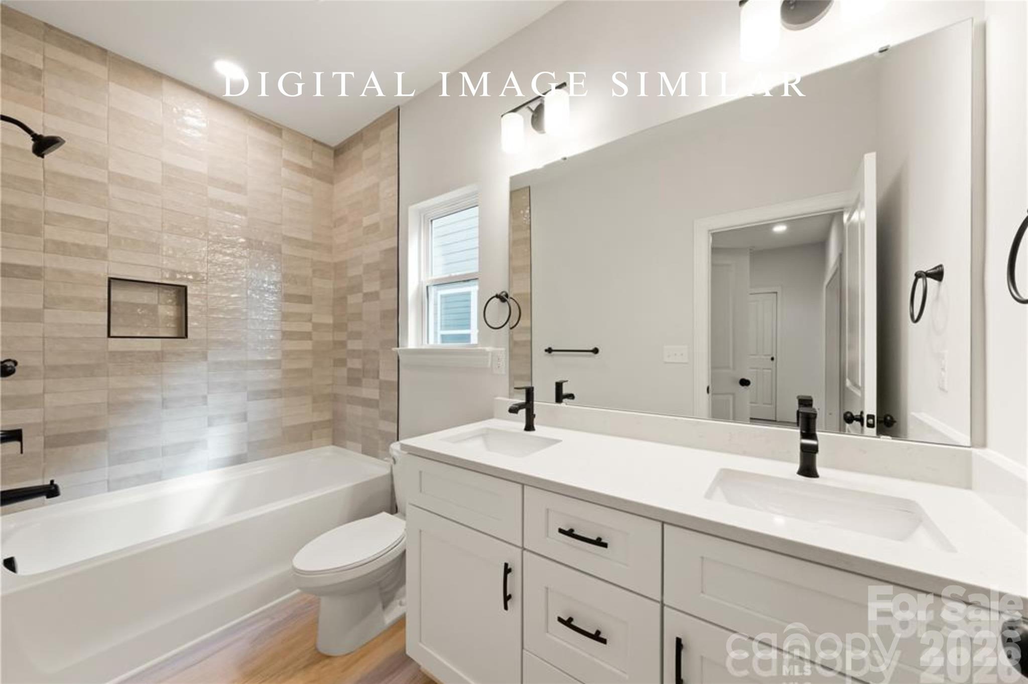 2928 Mulberry Church Road Charlotte, NC 28208 - Photo 29 of 43 a bathroom with a double vanity sink toilet and shower