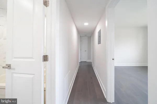 a view of a hallway with stairs