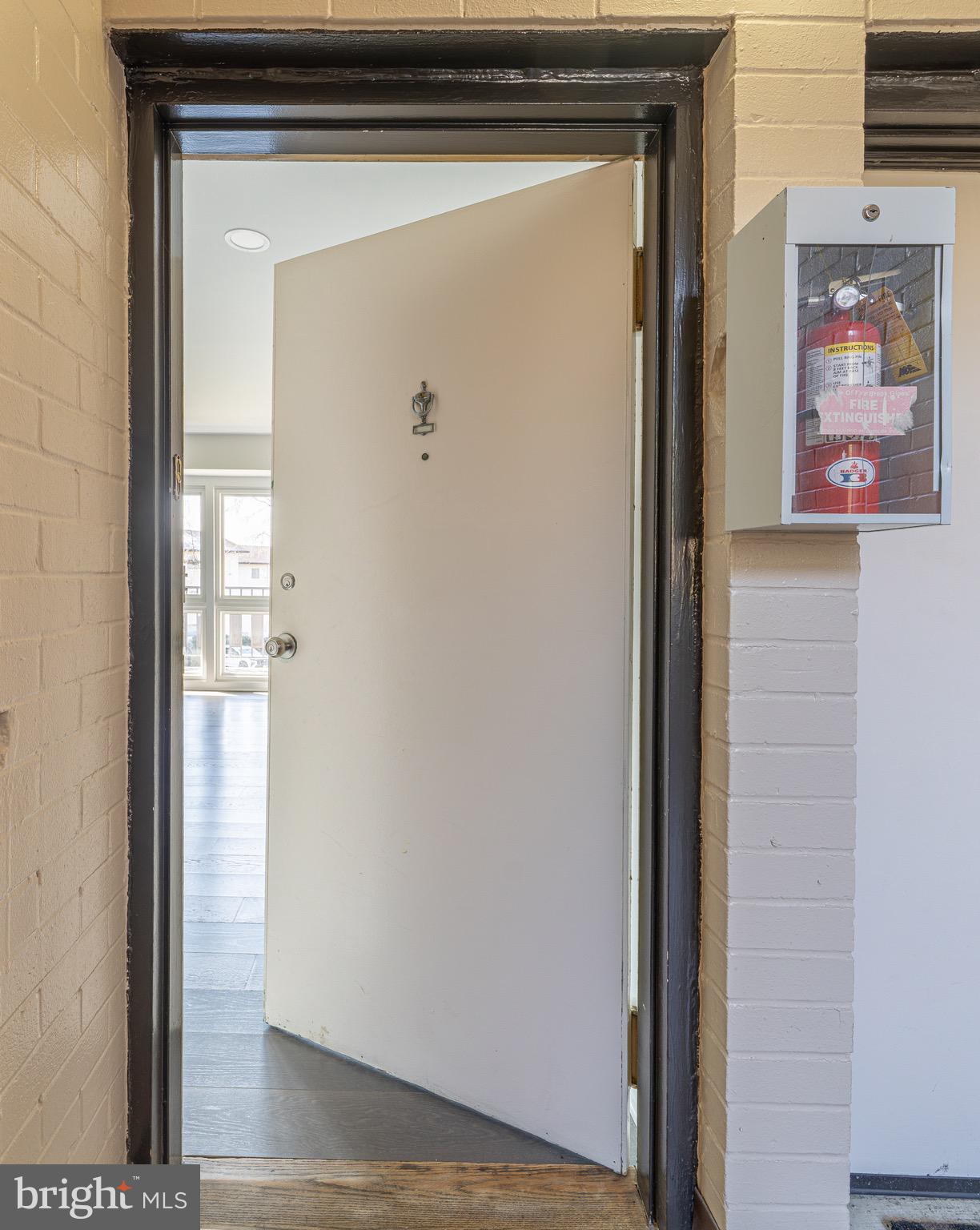 3122 Brinkley Road, Unit 102 Temple Hills, MD 20748 - Photo 6 of 44 a view of a hallway with wooden floor