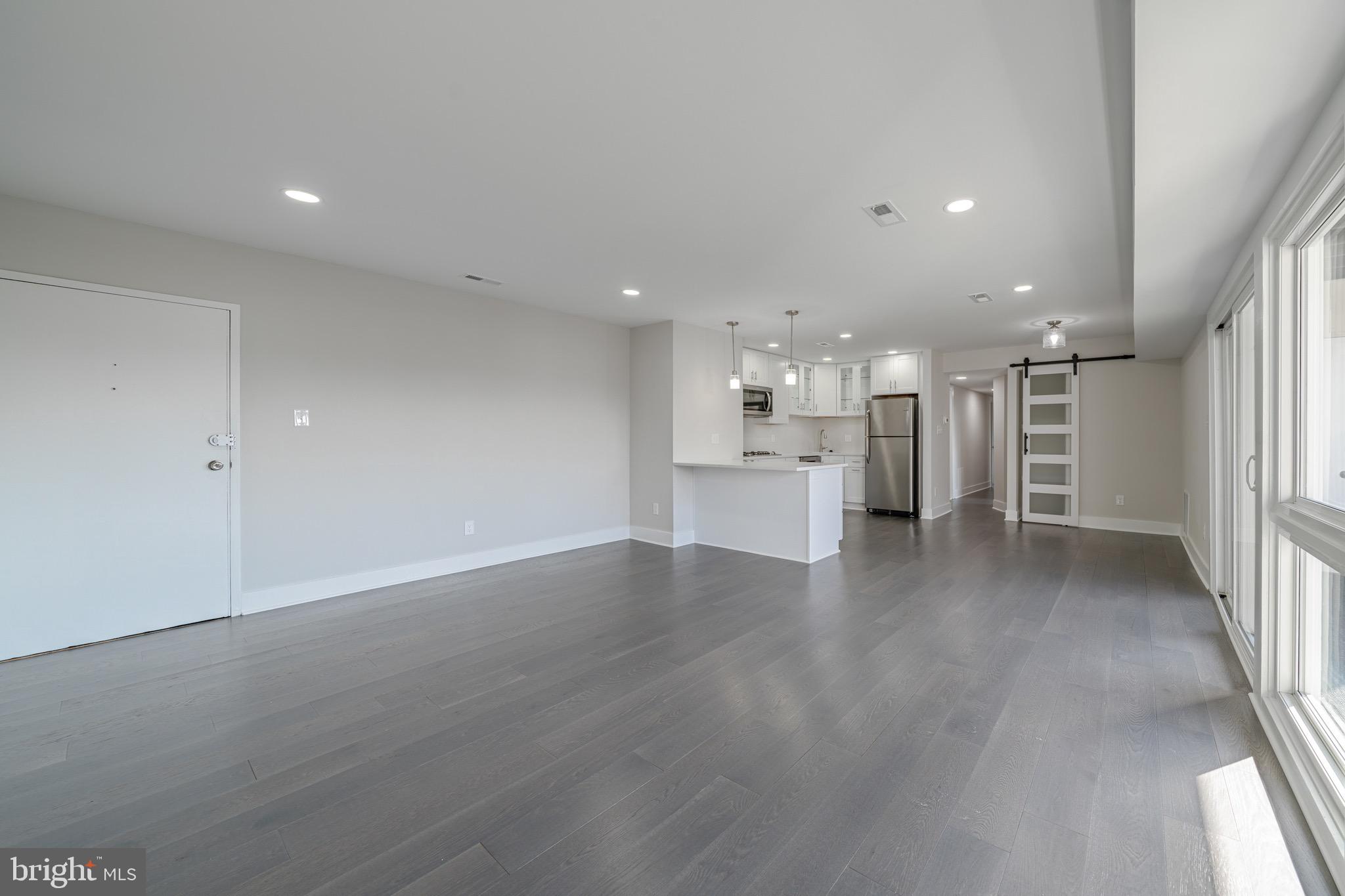 3122 Brinkley Road, Unit 102 Temple Hills, MD 20748 - Photo 8 of 44 a view of a kitchen with a sink and a stove top oven
