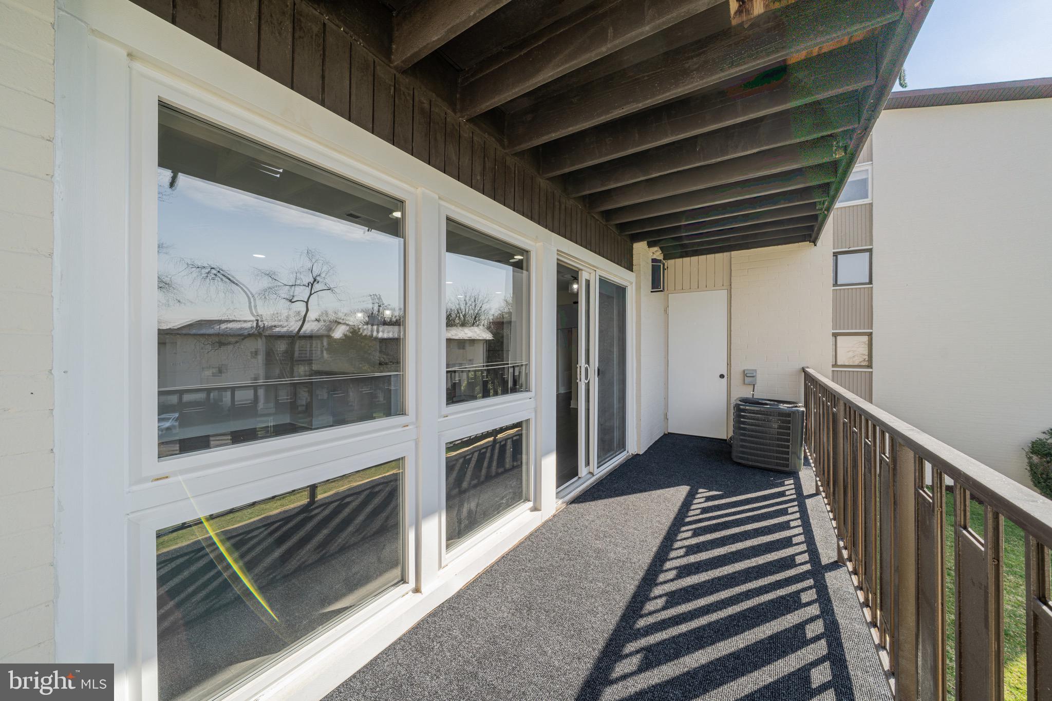 3122 Brinkley Road, Unit 102 Temple Hills, MD 20748 - Photo 10 of 44 a view of a hallway with the entryway