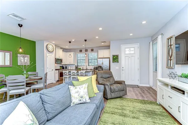a living room with furniture rug and window