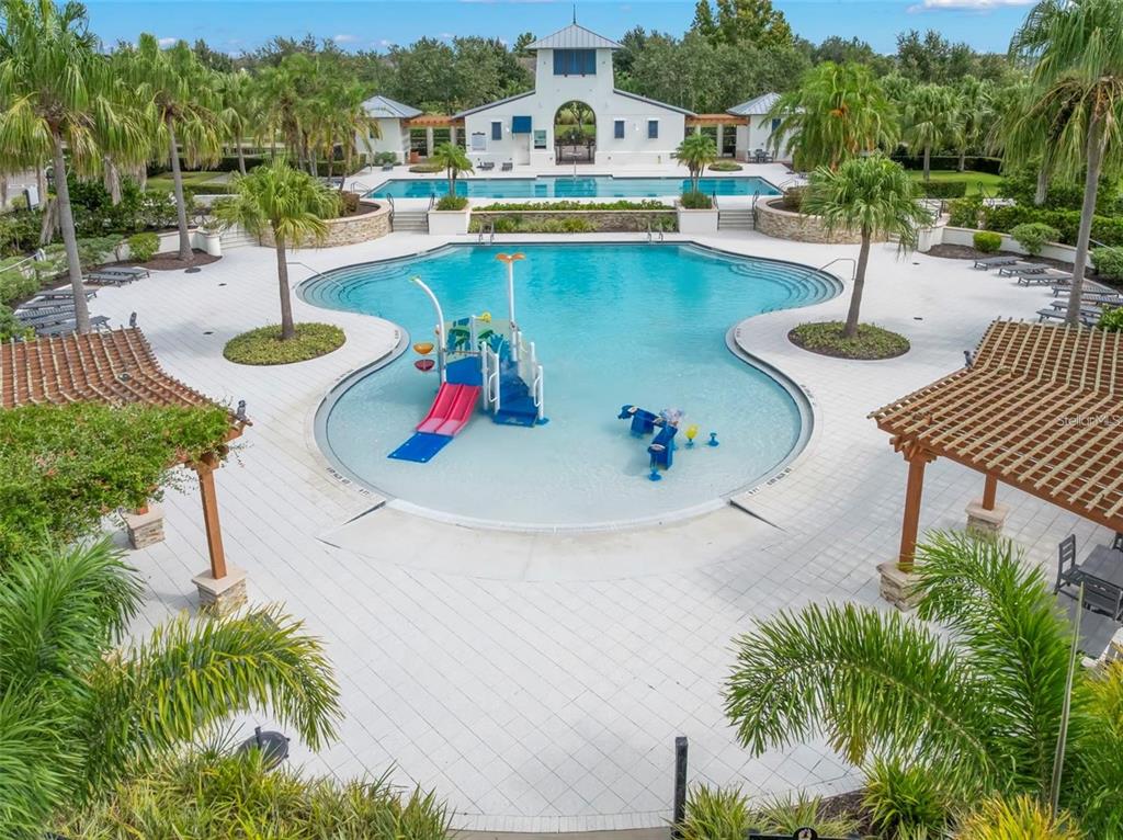 5703 Colony Glen Road Lithia, FL 33547 - Photo 41 of 56 a swimming pool with outdoor seating and yard