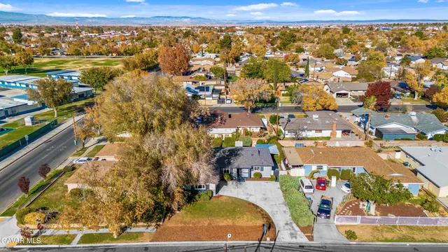 an aerial view of residential houses with outdoor space