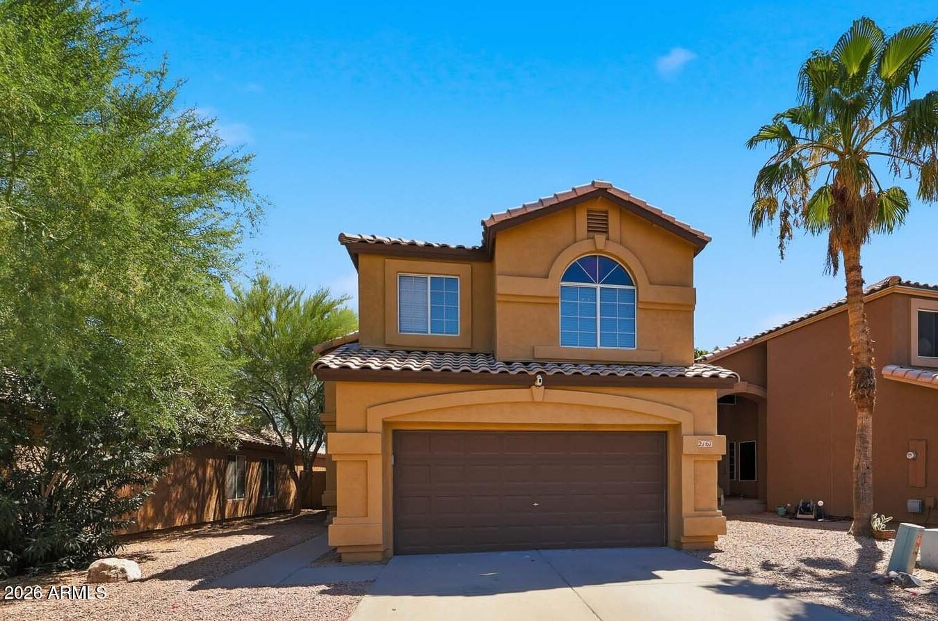 2167 East Nighthawk Way Phoenix, AZ 85048 - Photo 1 of 28 a front view of a house with a yard