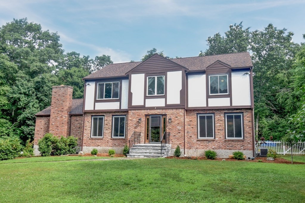 2 Mattakesett Circle Sharon, MA 02067 - Photo 1 of 40 a front view of a house with a garden