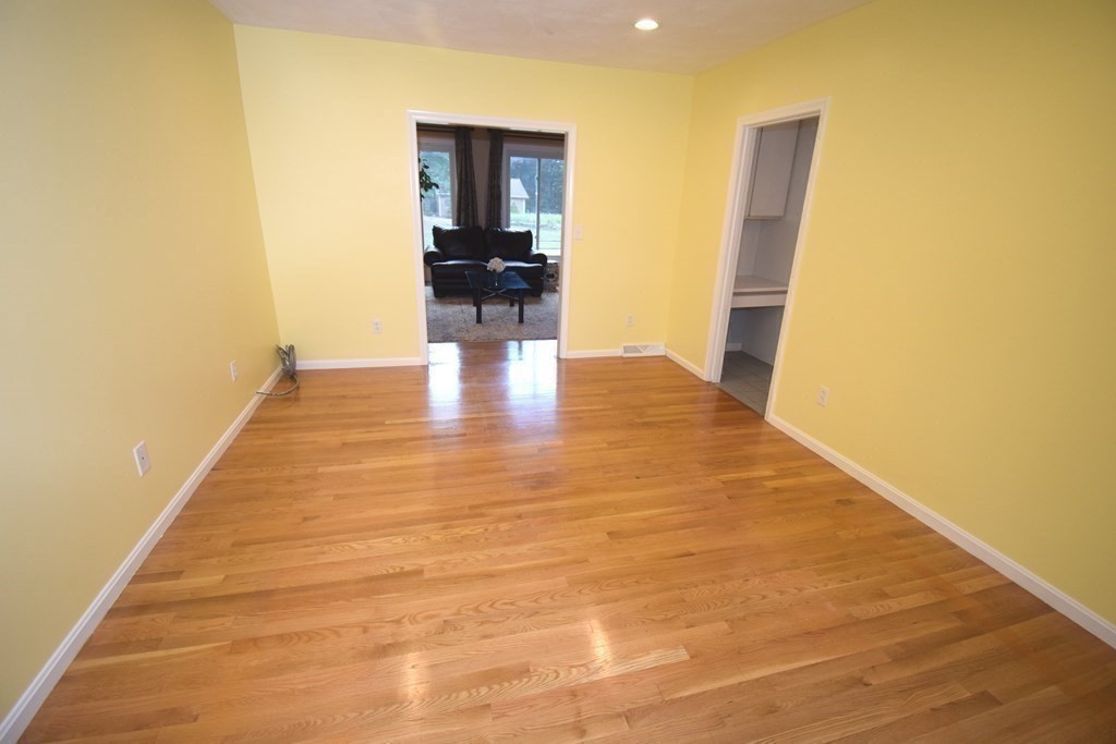 2 Mattakesett Circle Sharon, MA 02067 - Photo 12 of 40 a view of an empty room with wooden floor