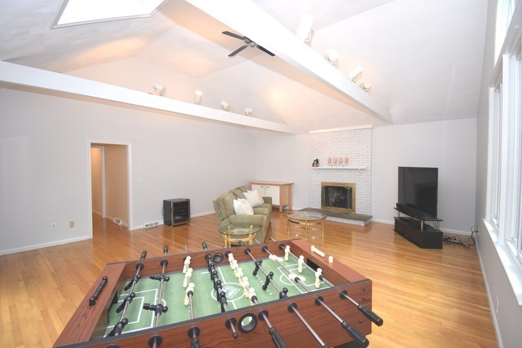 2 Mattakesett Circle Sharon, MA 02067 - Photo 15 of 40 a living room with fireplace furniture and a flat screen tv