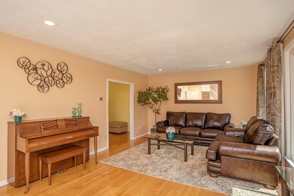 2 Mattakesett Circle Sharon, MA 02067 - Photo 2 of 40 a living room with furniture and a piano