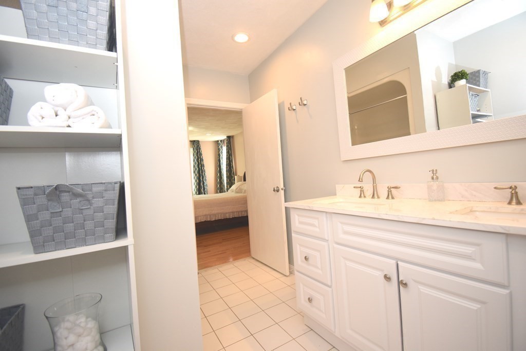 2 Mattakesett Circle Sharon, MA 02067 - Photo 21 of 40 a en suite bathroom with a sink and a mirror