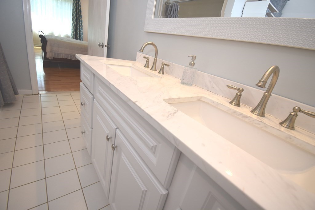 2 Mattakesett Circle Sharon, MA 02067 - Photo 22 of 40 a bathroom with a sink and a mirror
