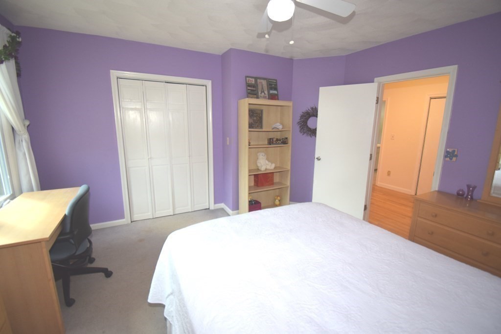 2 Mattakesett Circle Sharon, MA 02067 - Photo 25 of 40 a spacious bedroom with a bed and a dresser