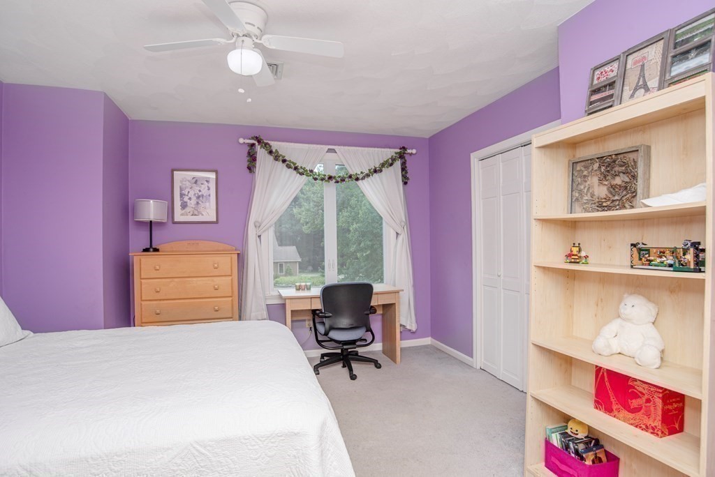 2 Mattakesett Circle Sharon, MA 02067 - Photo 26 of 40 a bedroom with a bed and a dresser with the shoe rack
