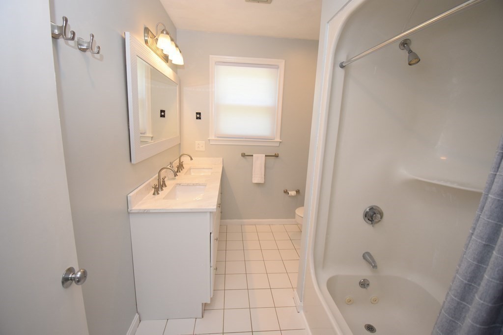 2 Mattakesett Circle Sharon, MA 02067 - Photo 31 of 40 a bathroom with a tub sink and mirror