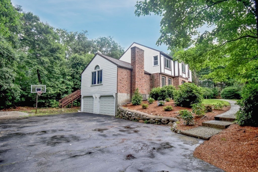2 Mattakesett Circle Sharon, MA 02067 - Photo 37 of 40 a view of a house with a yard and large trees