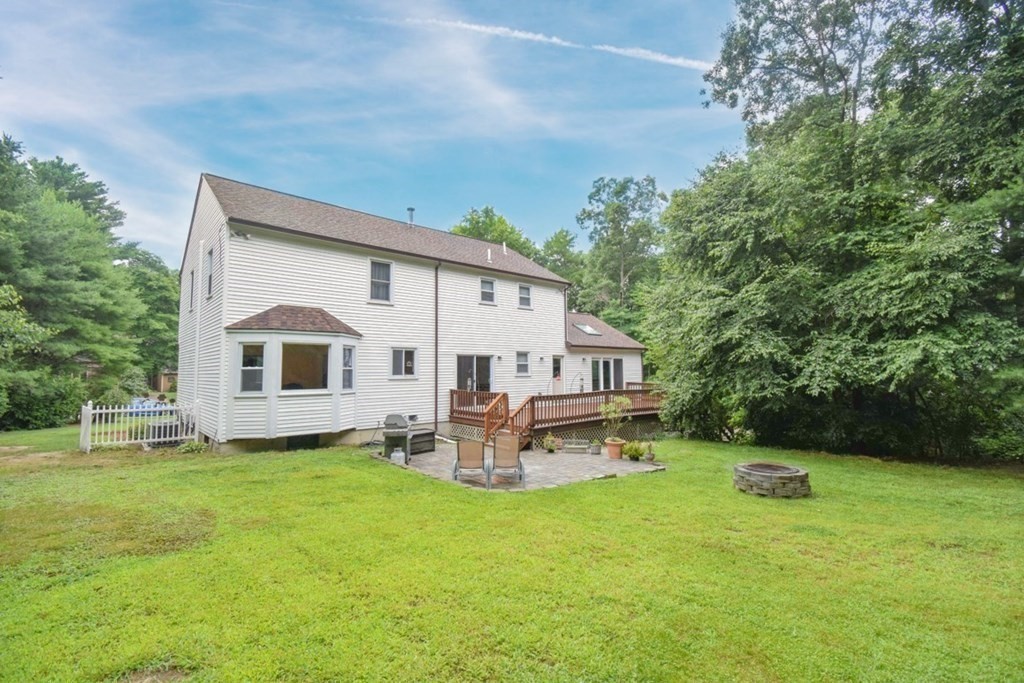 2 Mattakesett Circle Sharon, MA 02067 - Photo 38 of 40 a white house that has a tree in front of it