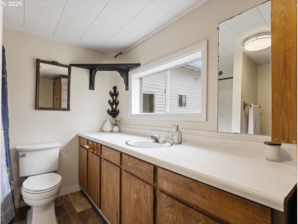 246 Jacobson Road Cathlamet, WA 98612 - Photo 21 of 33 a bathroom with a toilet sink and mirror