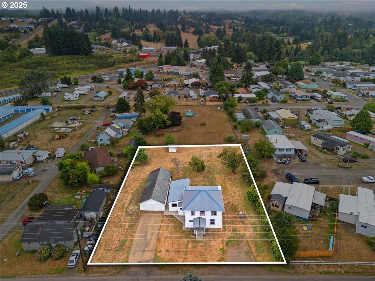 246 Jacobson Road Cathlamet, WA 98612 - Photo 26 of 33 an aerial view of a house with a swimming pool