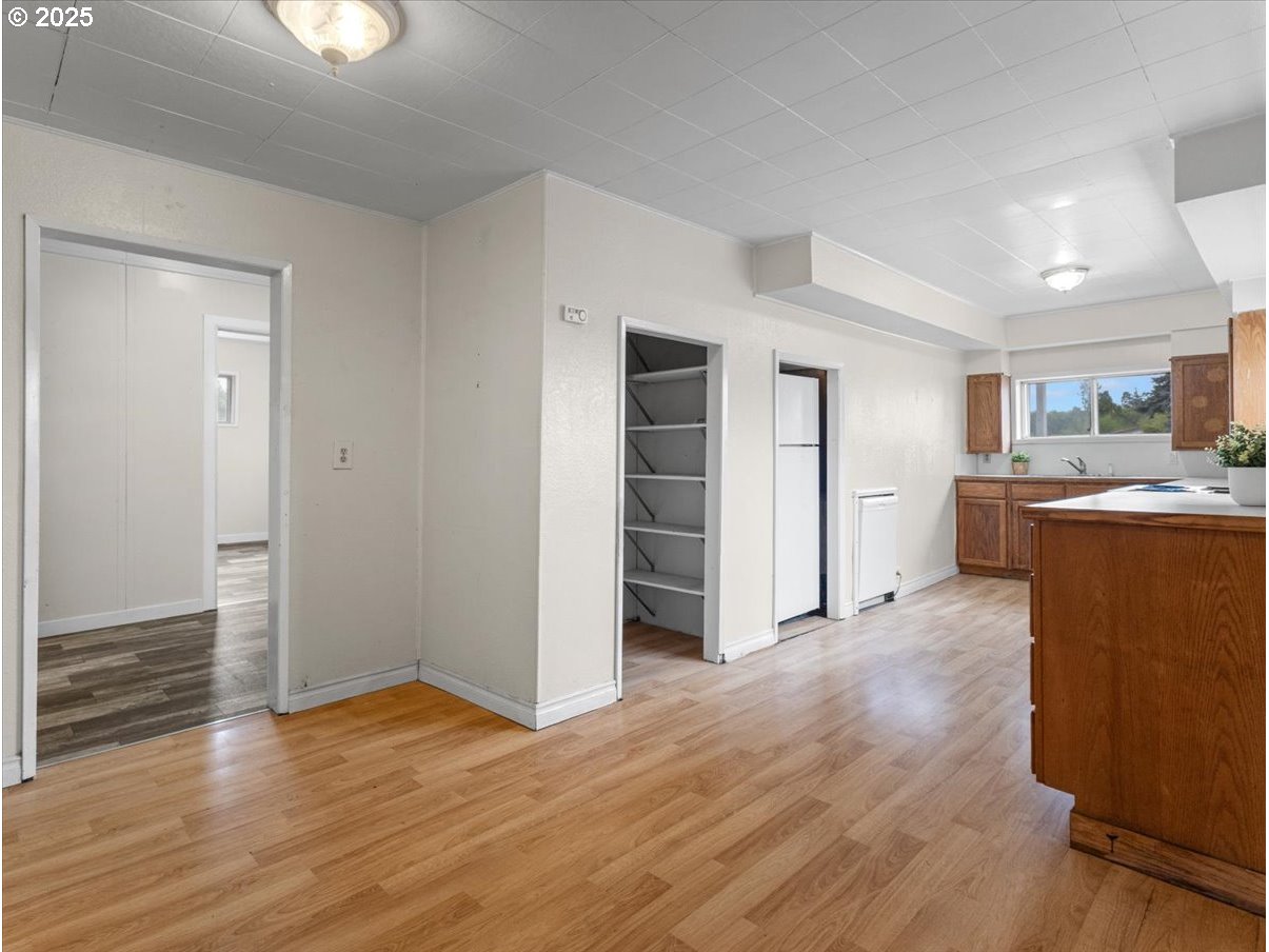 246 Jacobson Road Cathlamet, WA 98612 - Photo 6 of 33 a view of a kitchen with wooden floor and a sink