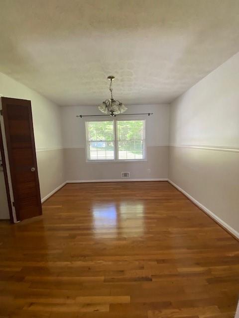 5262 Happy Hollow Road Atlanta, GA 30360 - Photo 14 of 18 an empty room with wooden floor and windows