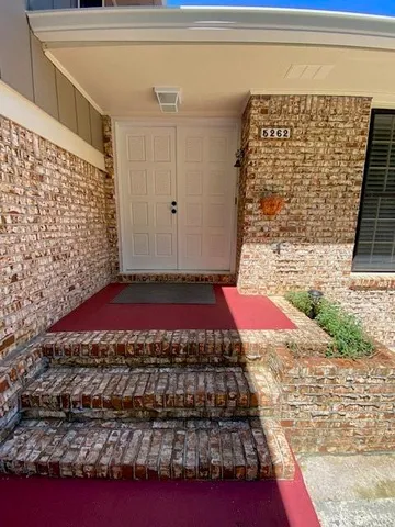a view of a backyard of a house