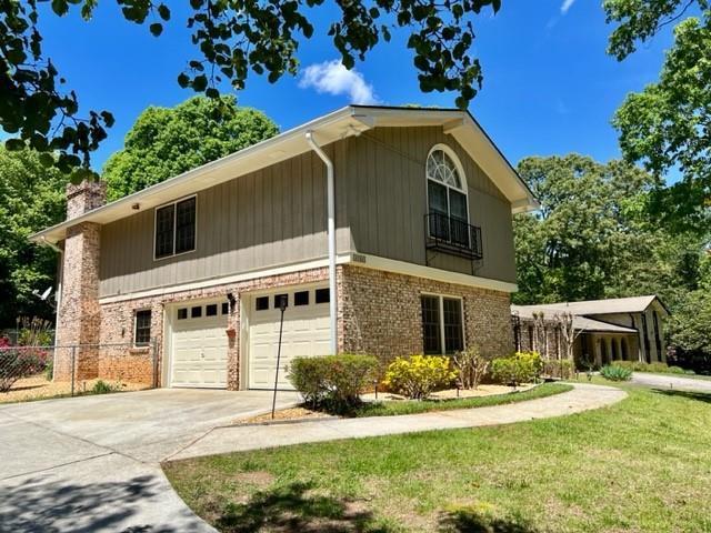 5262 Happy Hollow Road Atlanta, GA 30360 - Photo 2 of 18 a front view of a house with a yard