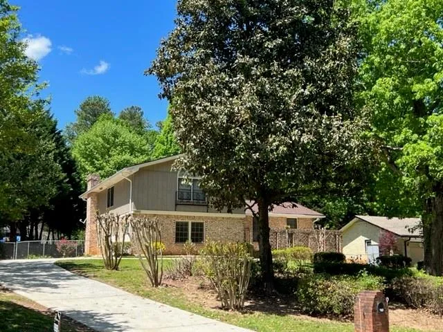 a front view of a house with garden