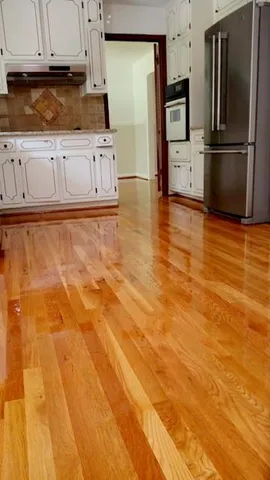 a kitchen with granite countertop a refrigerator and a stove
