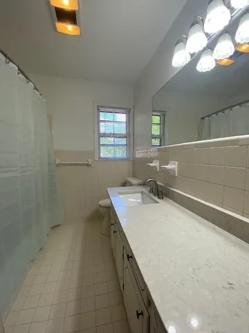 a bathroom with a sink a vanity and a mirror