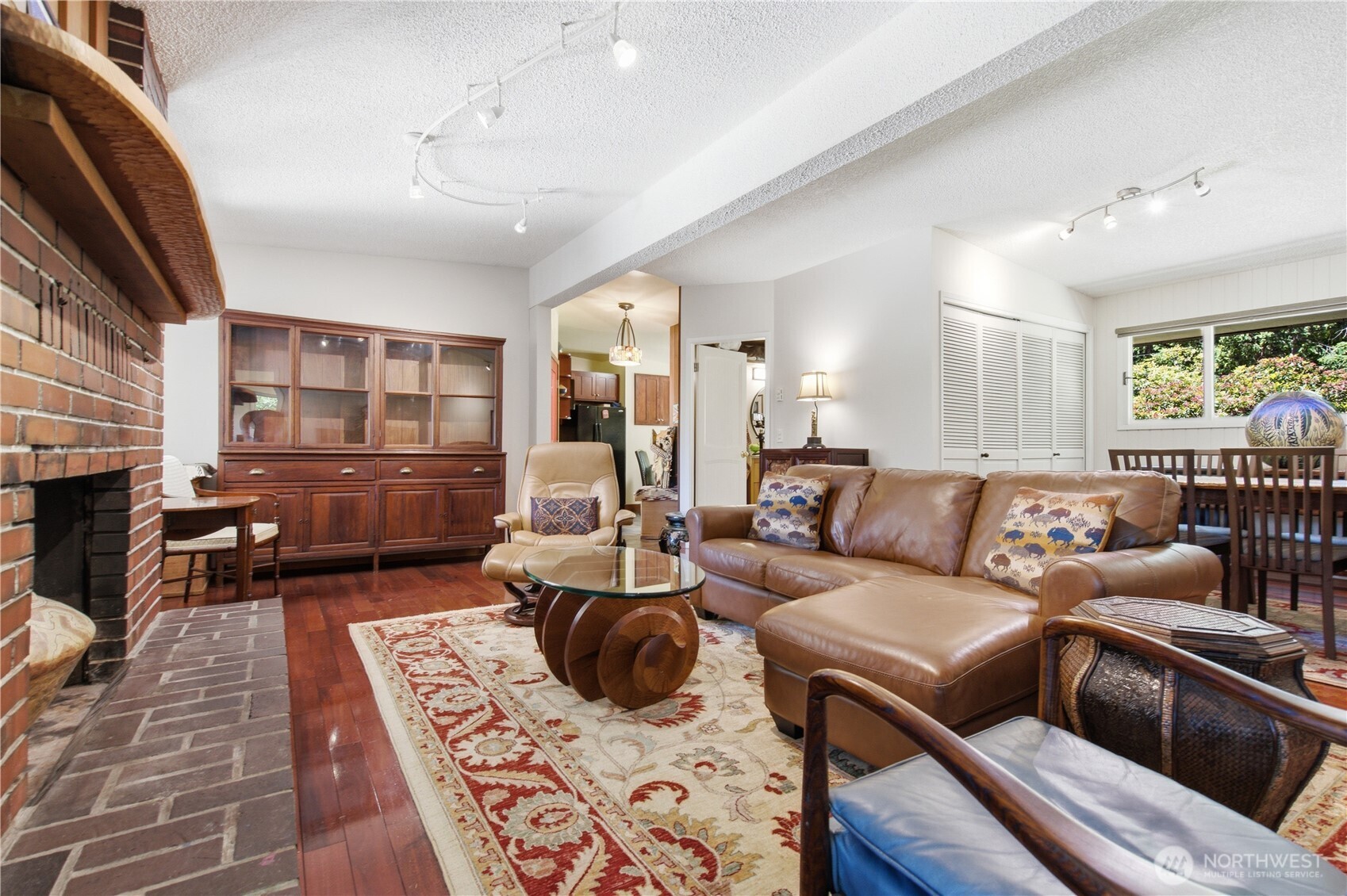 3050 Southeast Mullenix Road Port Orchard, WA 98367 - Photo 20 of 40 a living room with furniture fireplace and a table