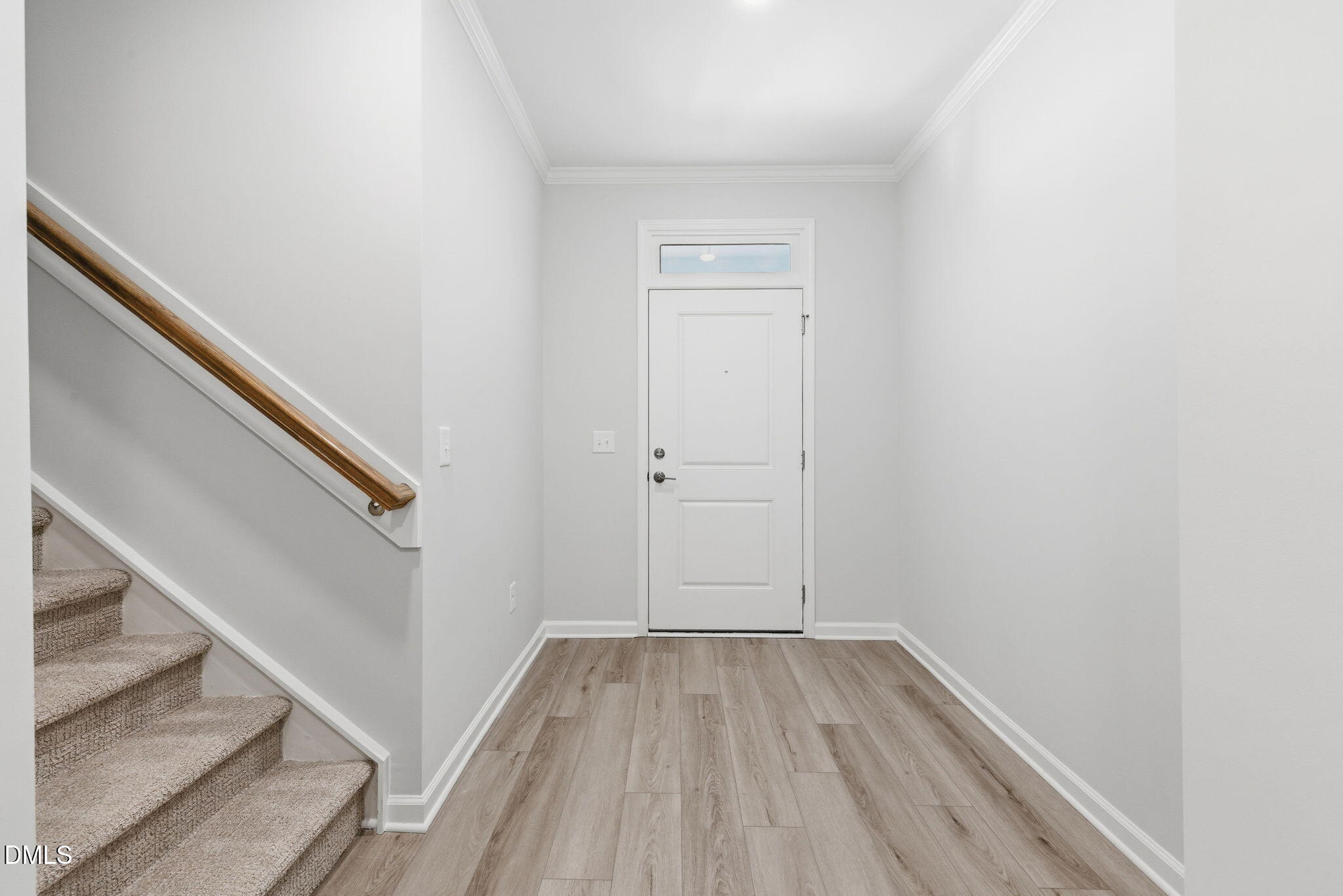 712 Blackpool Drive Durham, NC 27703 - Photo 3 of 22 a view of a hallway with wooden floor and staircase