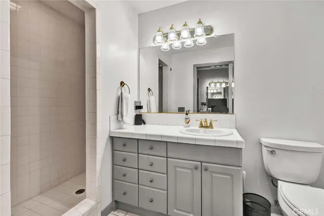 a view of a patio with a table and chairs under an umbrella